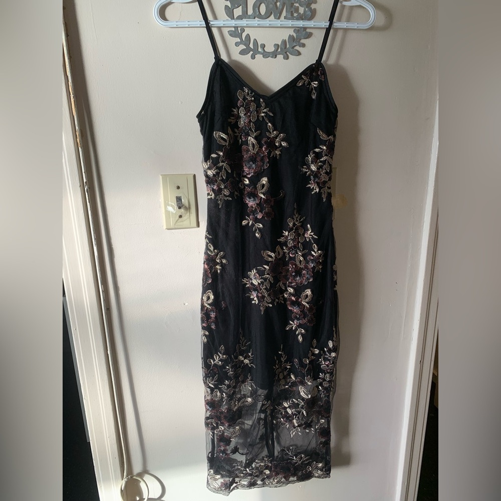 Black dress with embellished appliqués